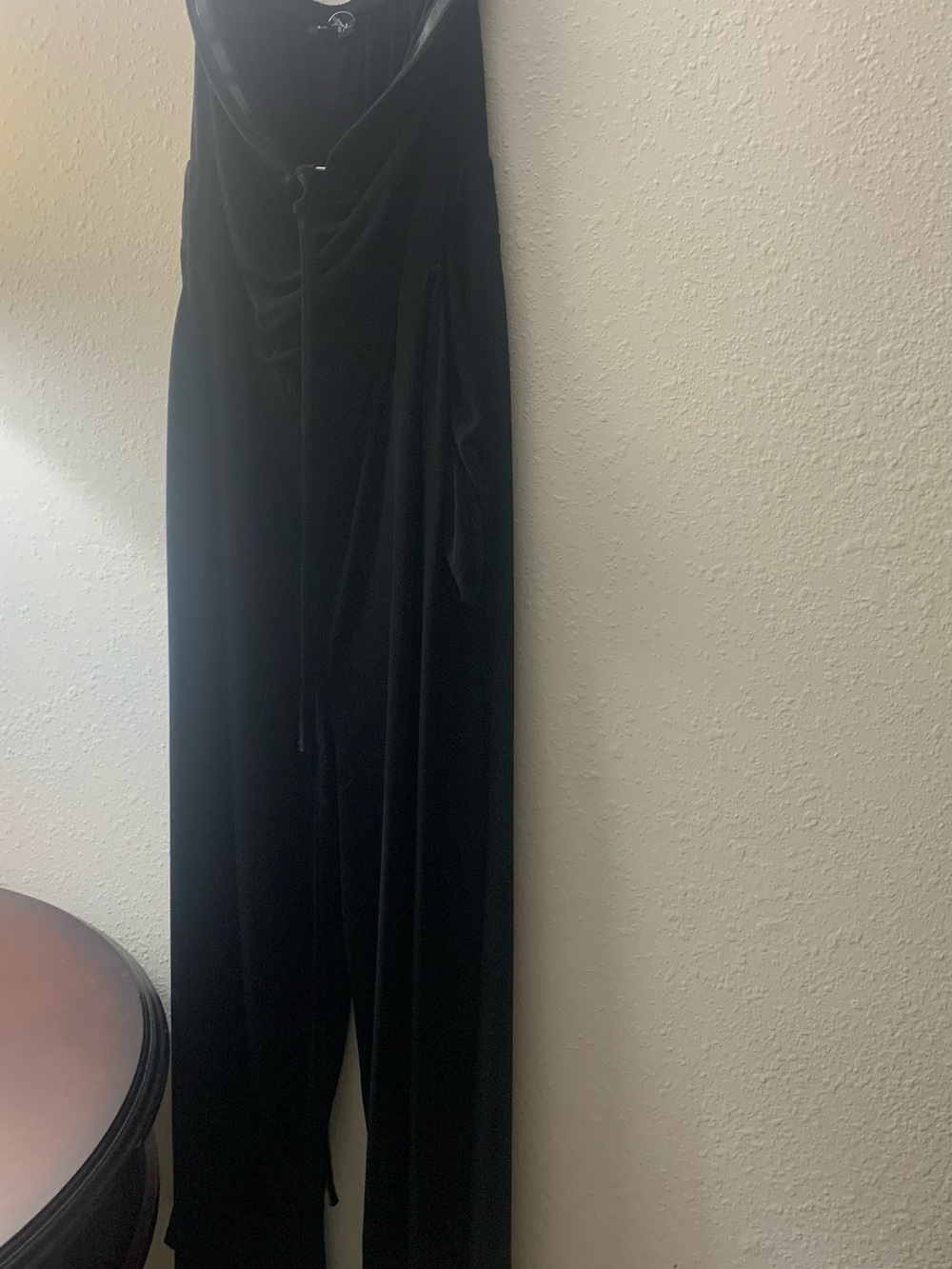 torrid Black Wide-Leg Tie-Waist Strapless Jumpsuit with Draped Bodice.